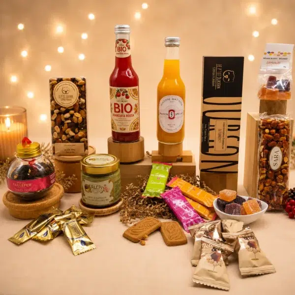 Cadeau gourmand composé de boissons sans alcool, thé de Noël, crème de pistache, chocolat mendiant, nougat italien, pâtes de fruits et gourmandises artisanales.