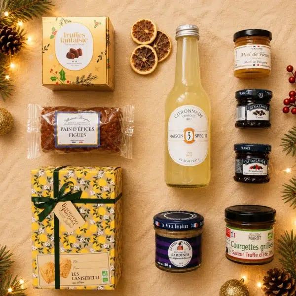 Composition gourmande de Noël avec citronnade bio, truffes au citron, pain d’épices aux figues, biscuits au citron, miel, confitures, rillettes de sardines et courgettes grillées à la truffe.